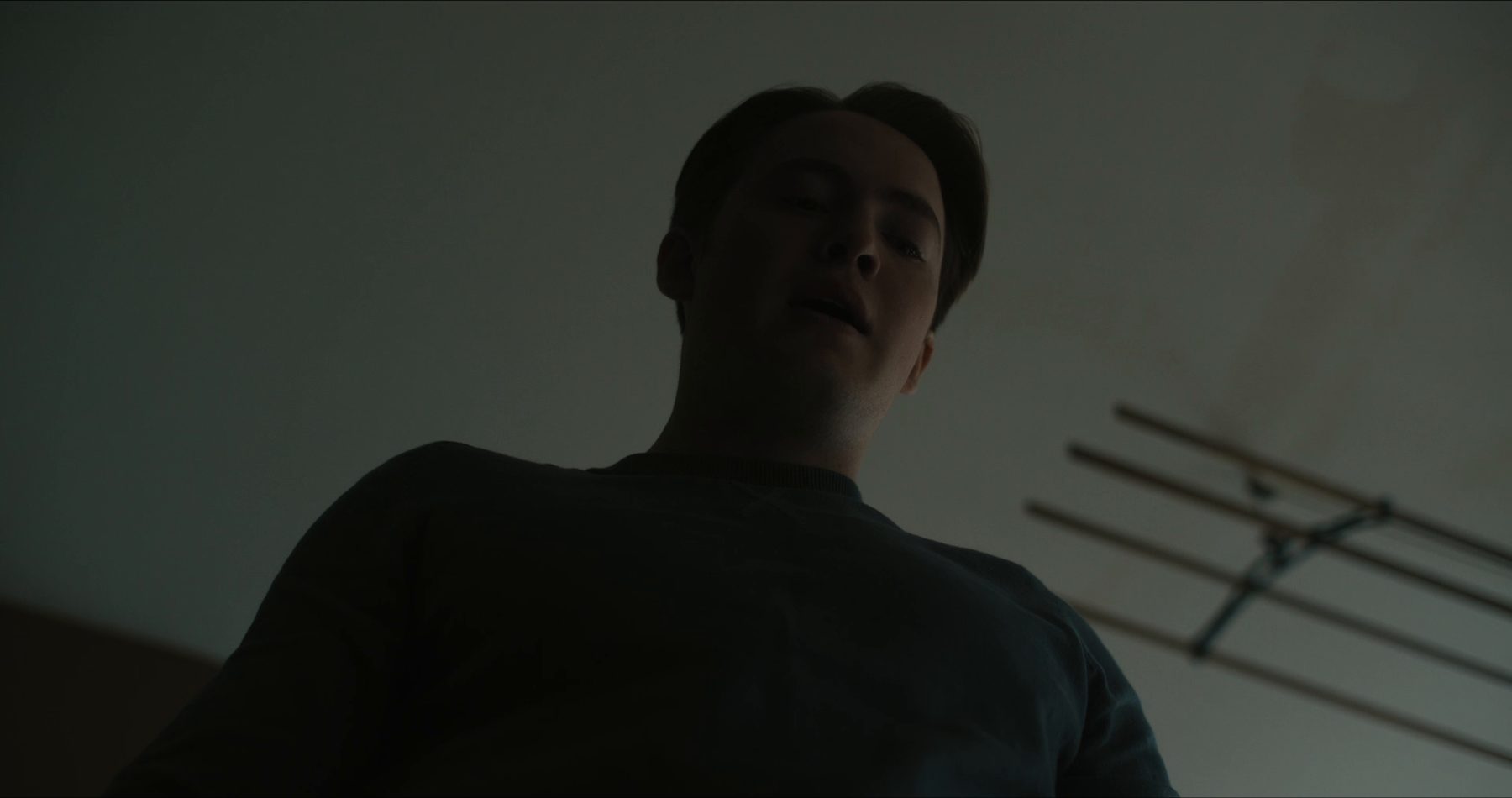 Youngest seen from below, looming over an open drawer